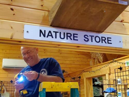 Craig - RV Workcamper fixing door at Nature Center - Sept 2022