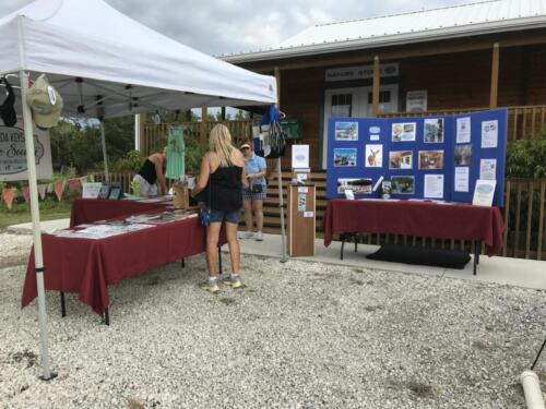 2021 Native Plant Day at the Nature Center. Big Pine Key. Volunteers setting up the Wildlife Society booth