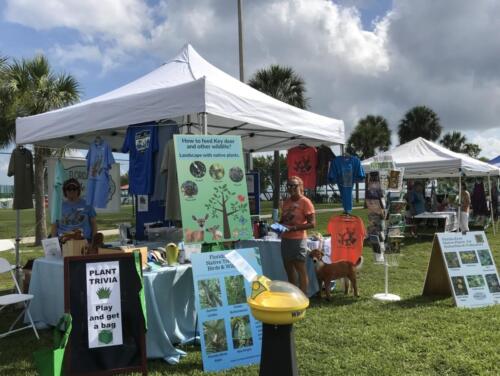 Tropical Fruit Fiesta June 18 2022 - Dawn and Jody set up items from Nature Store