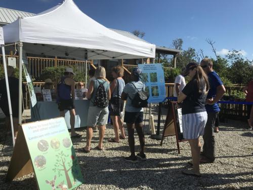 Native plant lovers waiting for trivia Qs to claim their plants at Native Plant Day - Oct 2022